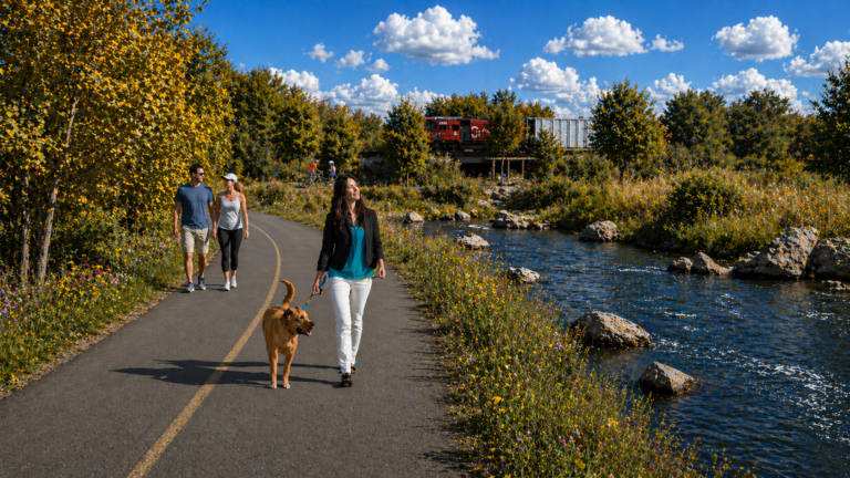 woman walking on paved trail along creek